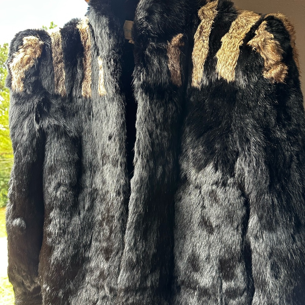 A black and tan Sergio Valente rabbit fur coat. Medium in size.